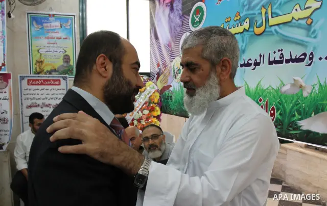 Freed Palestinian prisoner rawhi moshtaha is greeted by relatives and friends after his release from an Israeli jail in Gaza strip, on Oct. 20, 2011. who spent more than 23 years of isolation in a Gaza hide-out, for hund...