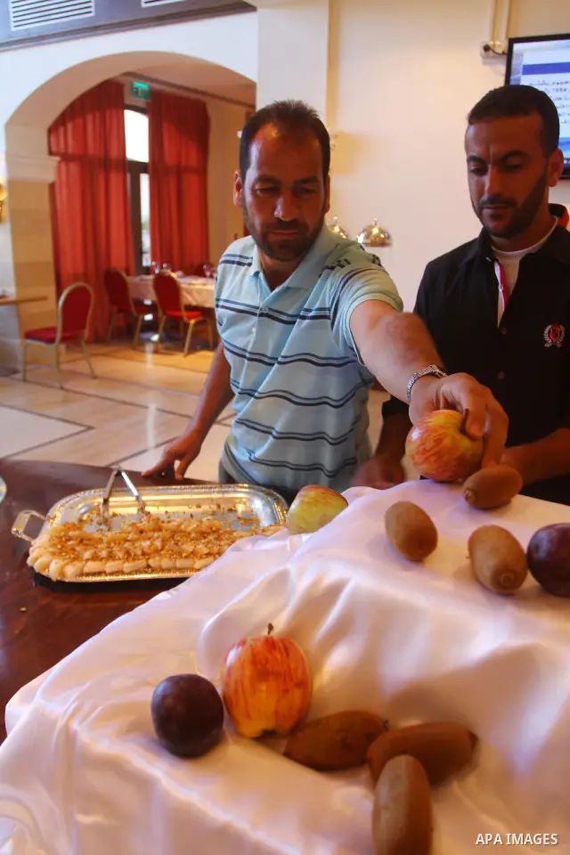 Freed Palestinian prisoners sit in the cafe of Al-Mashtal hotel, where they staying, in the Gaza Strip October 20, 2011. Israeli soldier Gilad Shalit and hundreds of Palestinians crossed Israel's borders in opposite dire...
