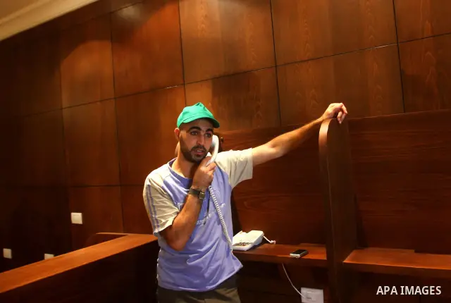 A freed Palestinian prisoner uses his phonel at Al-Mashtal hotel, where he and other former prisoners are currently staying, in the Gaza Strip Oct. 20, 2011. Israeli soldier Gilad Shalit and hundreds of Palestinians cros...