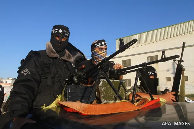 Army of Islam militants patrol during their visit to the freed Palestinian prisoners in Nusairat in central Gaza Strip October 20, 2011.The time is not right for meaningful Israeli-Palestinian peace talks, Palestinian Pr...