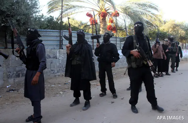 Army of Islam militants patrol during their visit to the freed Palestinian prisoners in Nusairat in central Gaza Strip October 20, 2011.The time is not right for meaningful Israeli-Palestinian peace talks, Palestinian Pr...