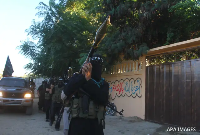 Army of Islam militants patrol during their visit to the freed Palestinian prisoners in Nusairat in central Gaza Strip October 20, 2011.The time is not right for meaningful Israeli-Palestinian peace talks, Palestinian Pr...