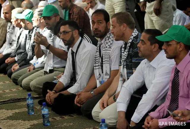 Freed Palestinian prisoners attend Friday prayer with Hamas leader Ismail Haniya (unseen) in Gaza City on October 21, 2011. Hamas rulers are enjoying a surge in popularity following the release earlier this week of 477 P...