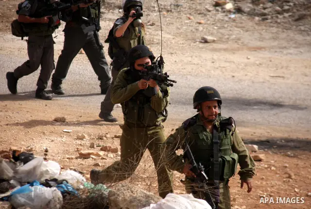 Israeli border police officers clash with Palestinian demonstrators as they demand access to their land near Kufr Qaddum, close to the northern West Bank Jewish settlement of Kdumim, Friday, Oct. 21, 2011. Photo by Wagdi...