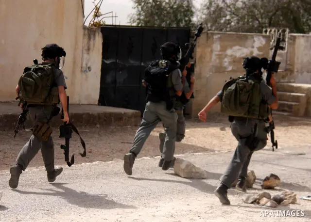 Israeli border police officers clash with Palestinian demonstrators as they demand access to their land near Kufr Qaddum, close to the northern West Bank Jewish settlement of Kdumim, Friday, Oct. 21, 2011. Photo by Wagdi...