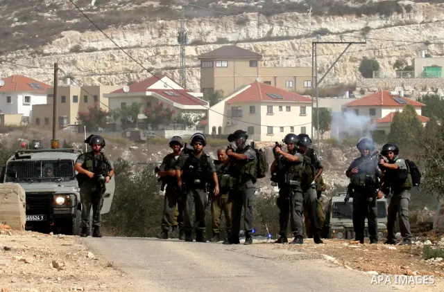 Israeli border police officers clash with Palestinian demonstrators as they demand access to their land near Kufr Qaddum, close to the northern West Bank Jewish settlement of Kdumim, Friday, Oct. 21, 2011. Photo by Wagdi...