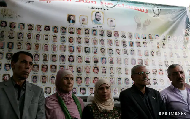 Freed Palestinian prisoners are greeted by others following their release from Israeli jails, at Red Cross headquarters in east Jerusalem on October 21, 2011. The Palestinian Hamas movement exchanged Gilad Shalit, the Is...