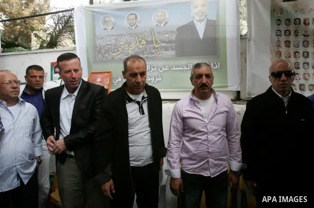 Freed Palestinian prisoners are greeted by others following their release from Israeli jails, at Red Cross headquarters in east Jerusalem on October 21, 2011. The Palestinian Hamas movement exchanged Gilad Shalit, the Is...