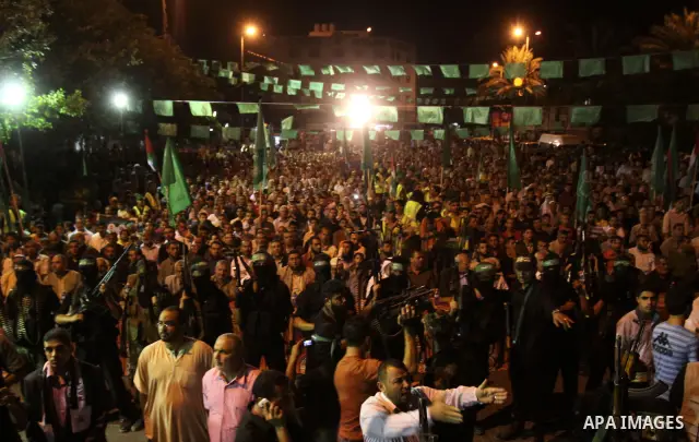 Palestinian supporters of the Islamic group Hamas celebrate the release of hundreds of prisoners following a swap with captured Israeli soldier Gilad Shalit on October 21, 2011 in Gaza city. Hamas rulers are enjoying a s...