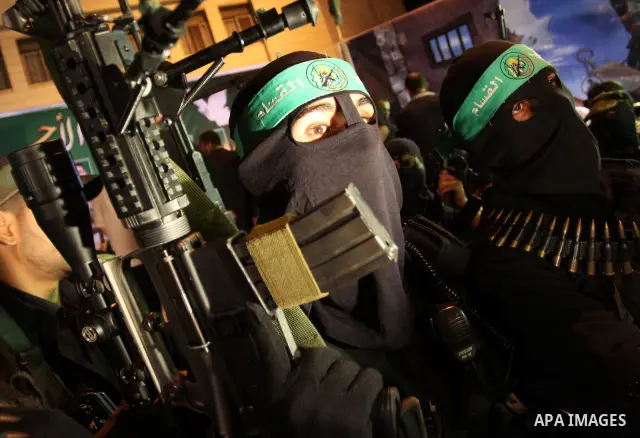 Palestinian militants of the Islamic group Hamas attend a celebration the release of hundreds of prisoners following a swap with captured Israeli soldier Gilad Shalit on October 21, 2011 in Gaza city. Hamas rulers are en...