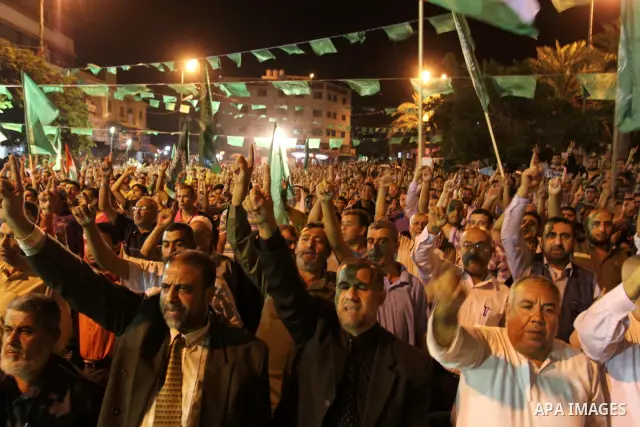 Palestinian supporters of the Islamic group Hamas celebrate the release of hundreds of prisoners following a swap with captured Israeli soldier Gilad Shalit on October 21, 2011 in Gaza city. Hamas rulers are enjoying a s...