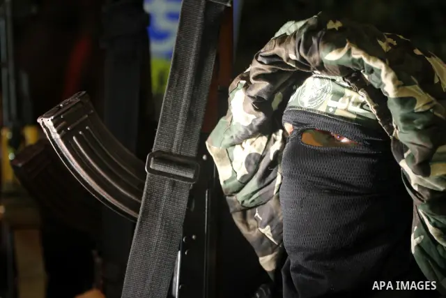 Palestinian militants of the Islamic group Hamas attend a celebration the release of hundreds of prisoners following a swap with captured Israeli soldier Gilad Shalit on October 21, 2011 in Gaza city. Hamas rulers are en...