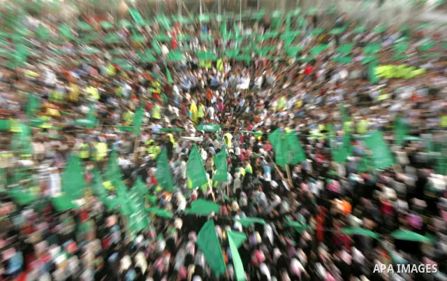 Palestinian supporters of the Islamic group Hamas celebrate the release of hundreds of prisoners following a swap with captured Israeli soldier Gilad Shalit on October 21, 2011 in Khan Yunis, southern Gaza Strip. Hamas r...