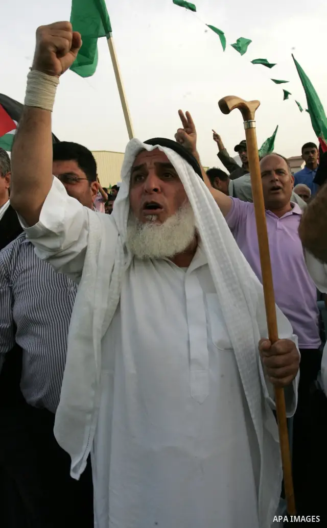 Palestinian supporters of the Islamic group Hamas celebrate the release of hundreds of prisoners following a swap with captured Israeli soldier Gilad Shalit on October 21, 2011 in Khan Yunis, southern Gaza Strip. Hamas r...