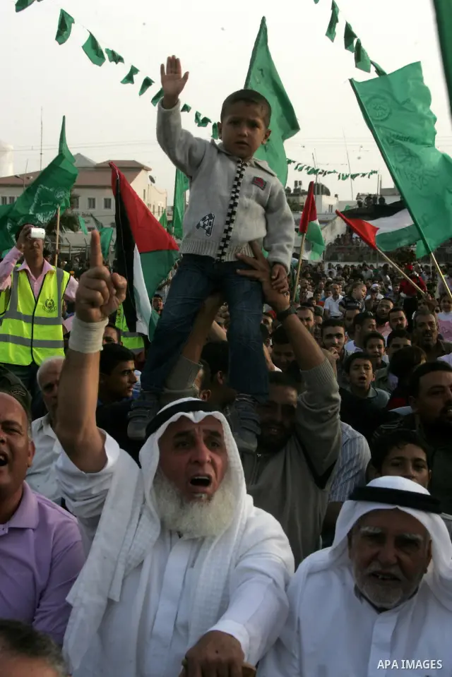 Palestinian supporters of the Islamic group Hamas celebrate the release of hundreds of prisoners following a swap with captured Israeli soldier Gilad Shalit on October 21, 2011 in Khan Yunis, southern Gaza Strip. Hamas r...