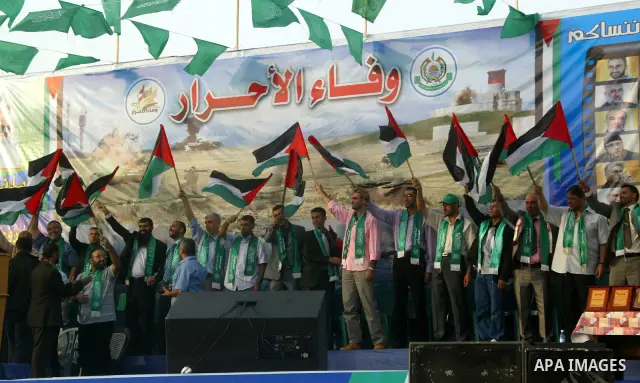 Freed Palestinian prisoners attend a rally as Hamas supporters celebrate the release of hundreds of prisoners following a swap with captured Israeli soldier Gilad Shalit on October 21, 2011 in Khan Yunis, southern Gaza S...