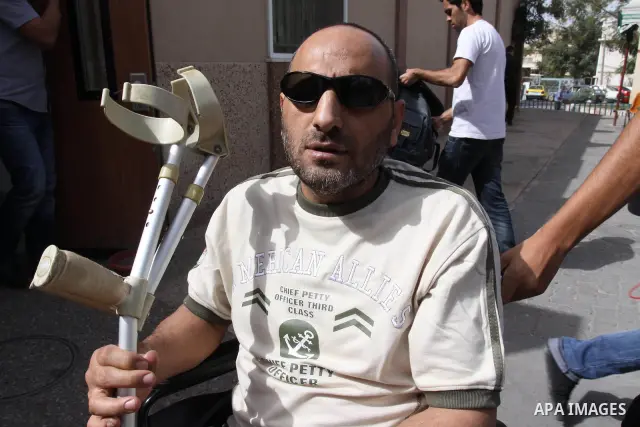 A freed Palestinian prisoner Khalil Abu Olba sits at the Al-Shifa Hospital, where a group of prisoners were exiled upon their release from Israeli jails, in Gaza City October 22, 2011. Shalit and hundreds of Palestinians...