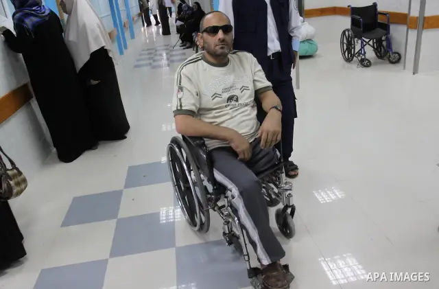 A freed Palestinian prisoner Khalil Abu Olba sits at the Al-Shifa Hospital, where a group of prisoners were exiled upon their release from Israeli jails, in Gaza City October 22, 2011. Shalit and hundreds of Palestinians...