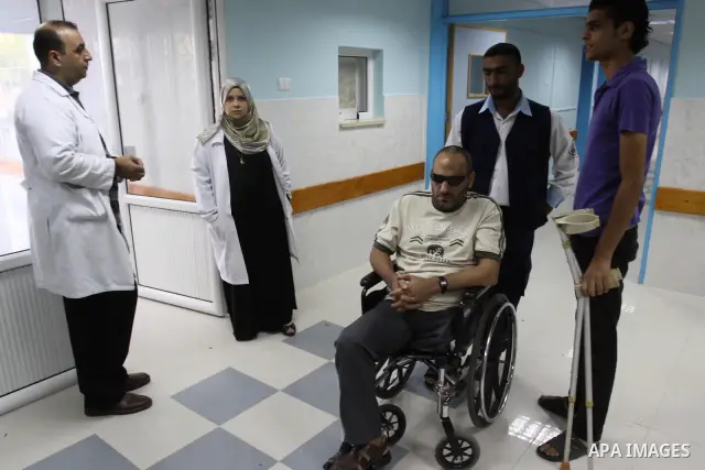 A freed Palestinian prisoner Khalil Abu Olba sits at the Al-Shifa Hospital, where a group of prisoners were exiled upon their release from Israeli jails, in Gaza City October 22, 2011. Shalit and hundreds of Palestinians...