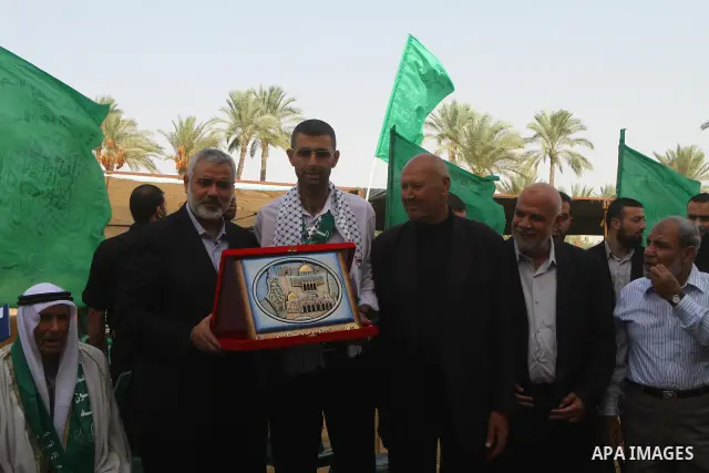 Palestinian prime minister in Gaza Strip, Ismail Haniya, visits a freedom prisoner Ahmad El-Faleet released in exchange for the captured Israeli soldier Gilad Schalit in Gaza City, Wednesday, Oct. 22, 2011.. Photo by Ash...