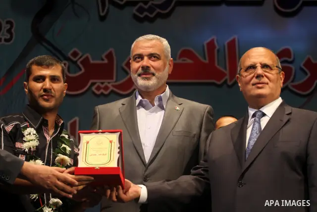 Palestinian Prime Minister in Gaza Strip, Ismail Haniyeh and Palestinian Legislative Council member, Jamal El Khodary honored freedom prisoners at the Islamic University in Gaza City on Oct. 23, 2011 . Photo by Mohammed...