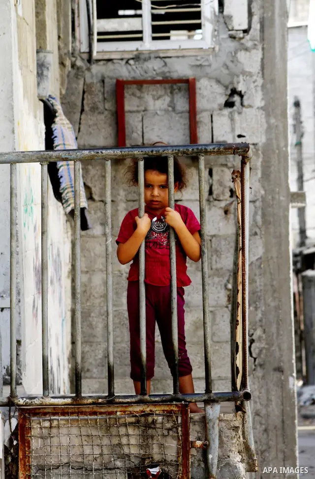 Palestinian refugee children play in front of their house at the Al-shatte' refugee camp in Gaza City on Oct. 23, 2011. Photo by Ashraf Amra
