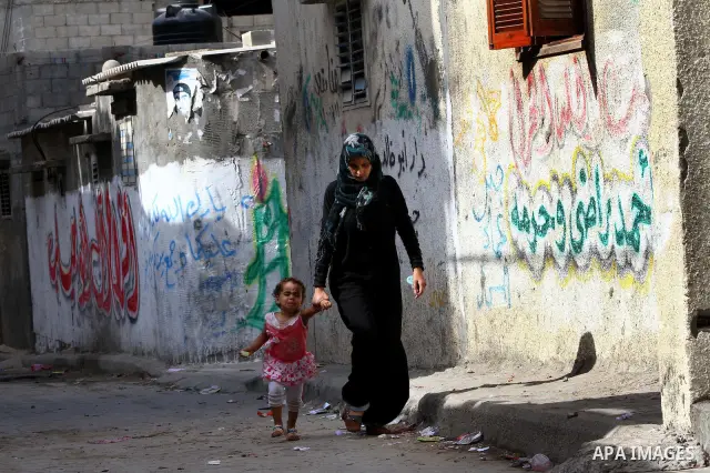 Palestinian refugee children play in front of their house at the Al-shatte' refugee camp in Gaza City on Oct. 23, 2011. Photo by Ashraf Amra