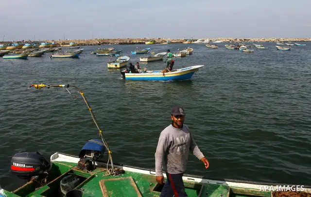 Palestinian fishermen work inside the port of Gaza City on Oct. 23, 2011. Fishermen, suffer from the tightening of the Israeli siege imposed on Palestinian fishermen a forbidden fishermen by Israel to enter the sea for m...