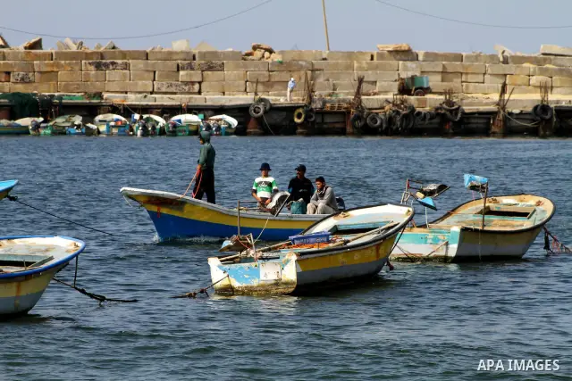 Palestinian fishermen work inside the port of Gaza City on Oct. 23, 2011. Fishermen, suffer from the tightening of the Israeli siege imposed on Palestinian fishermen a forbidden fishermen by Israel to enter the sea for m...