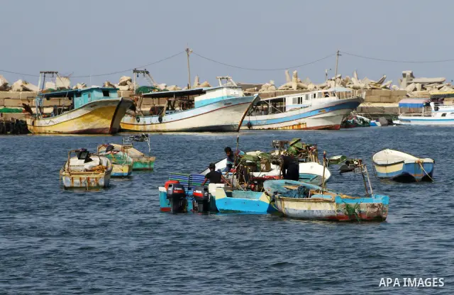 Palestinian fishermen work inside the port of Gaza City on Oct. 23, 2011. Fishermen, suffer from the tightening of the Israeli siege imposed on Palestinian fishermen a forbidden fishermen by Israel to enter the sea for m...