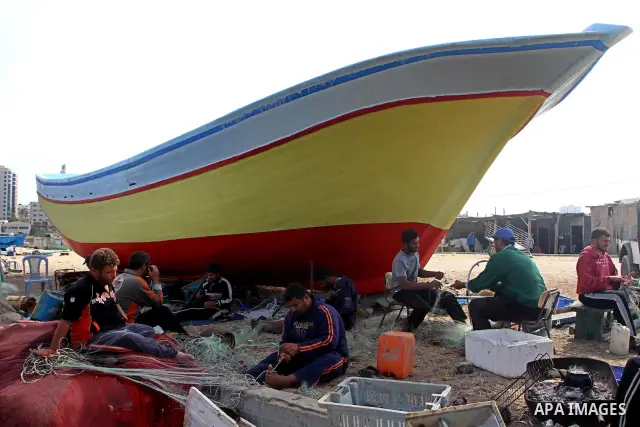 Palestinian fishermen work inside the port of Gaza City on Oct. 23, 2011. Fishermen, suffer from the tightening of the Israeli siege imposed on Palestinian fishermen a forbidden fishermen by Israel to enter the sea for m...