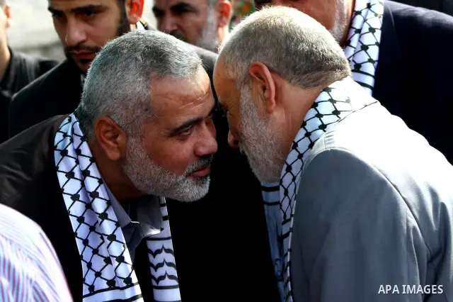 Palestinian prime minister in Gaza Strip, Ismail Haniya attends a celebration in Gaza city on Oct. 24,2011 with freed Palestinian prisoners who released to the Gaza Strip in a dramatic swap for a captive Israeli soldier...