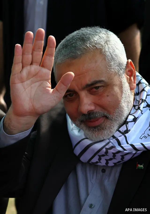 Palestinian prime minister in Gaza Strip, Ismail Haniya attends a celebration in Gaza city on Oct. 24,2011 with freed Palestinian prisoners who released to the Gaza Strip in a dramatic swap for a captive Israeli soldier...