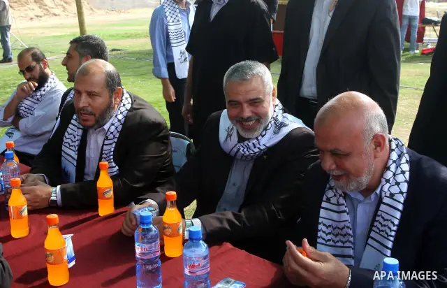 Palestinian prime minister in Gaza Strip, Ismail Haniya attends a celebration in Gaza city on Oct. 24,2011 with freed Palestinian prisoners who released to the Gaza Strip in a dramatic swap for a captive Israeli soldier...