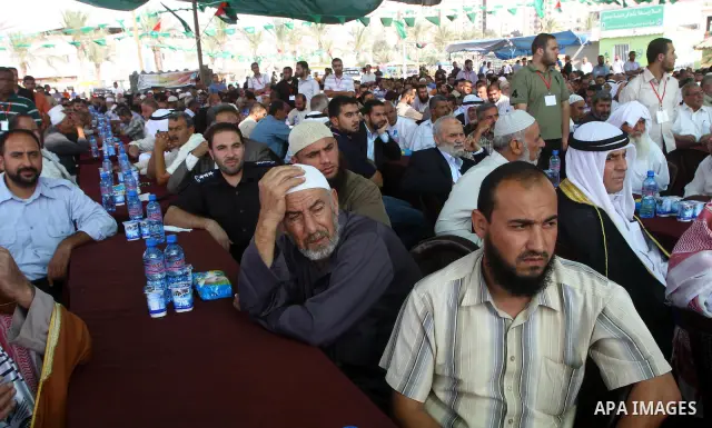 Freed Palestinian prisoners attend a celebration with Palestinian prime minister in Gaza Strip, Ismail Haniya in Gaza city on Oct. 24,2011. Prisoners released to the Gaza Strip in a dramatic swap for a captive Israeli so...