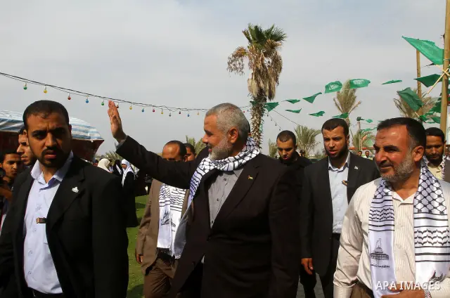 Palestinian prime minister in Gaza Strip, Ismail Haniya attends a celebration in Gaza city on Oct. 24,2011 with freed Palestinian prisoners who released to the Gaza Strip in a dramatic swap for a captive Israeli soldier...