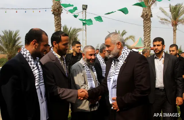 Palestinian prime minister in Gaza Strip, Ismail Haniya attends a celebration in Gaza city on Oct. 24,2011 with freed Palestinian prisoners who released to the Gaza Strip in a dramatic swap for a captive Israeli soldier...