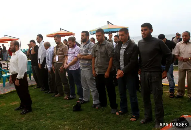 Freed Palestinian prisoners and their relatives attend a celebration on Gaza city beach on Oct. 25,2011. Prisoners released to the Gaza Strip in a dramatic swap for a captive Israeli soldier Gilad Shalit last week after...