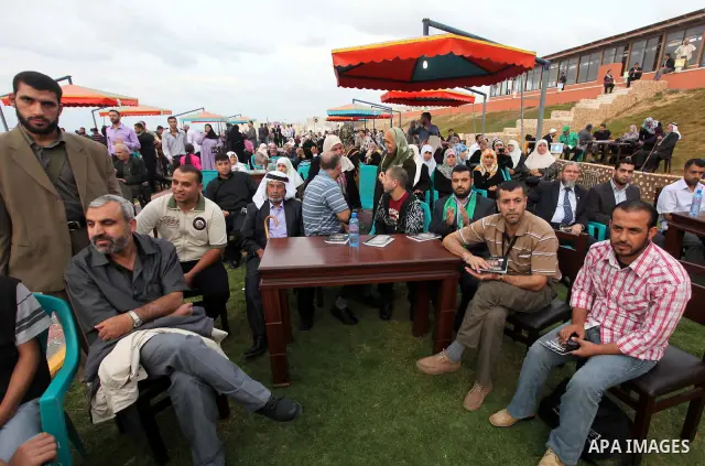Freed Palestinian prisoners and their relatives attend a celebration on Gaza city beach on Oct. 25,2011. Prisoners released to the Gaza Strip in a dramatic swap for a captive Israeli soldier Gilad Shalit last week after...