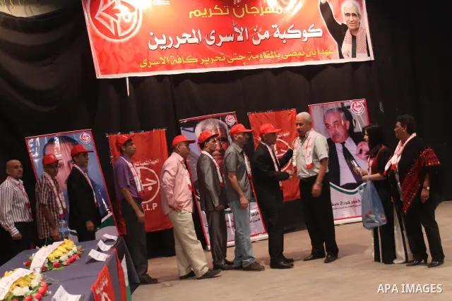 Freed Palestinian prisoners and their relatives attend a celebration organized by the Popular for Liberation Palestine in Gaza city on Oct. 26,2011. Prisoners released to the Gaza Strip in a dramatic swap for a captive I...