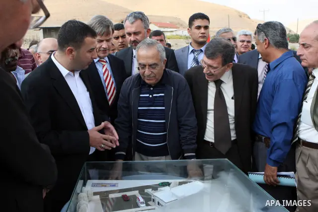 Palestinian Prime Minister Salam Fayyad and the German representative, Jayutz Lengenthal place the foundation stone for the health center in the West Bank city of Jericho on Oct. 26,2011. Photo by Mustafa Abu Dayeh