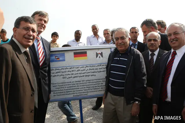 Palestinian Prime Minister Salam Fayyad and the German representative, Jayutz Lengenthal place the foundation stone for the health center in the West Bank city of Jericho on Oct. 26,2011. Photo by Mustafa Abu Dayeh
