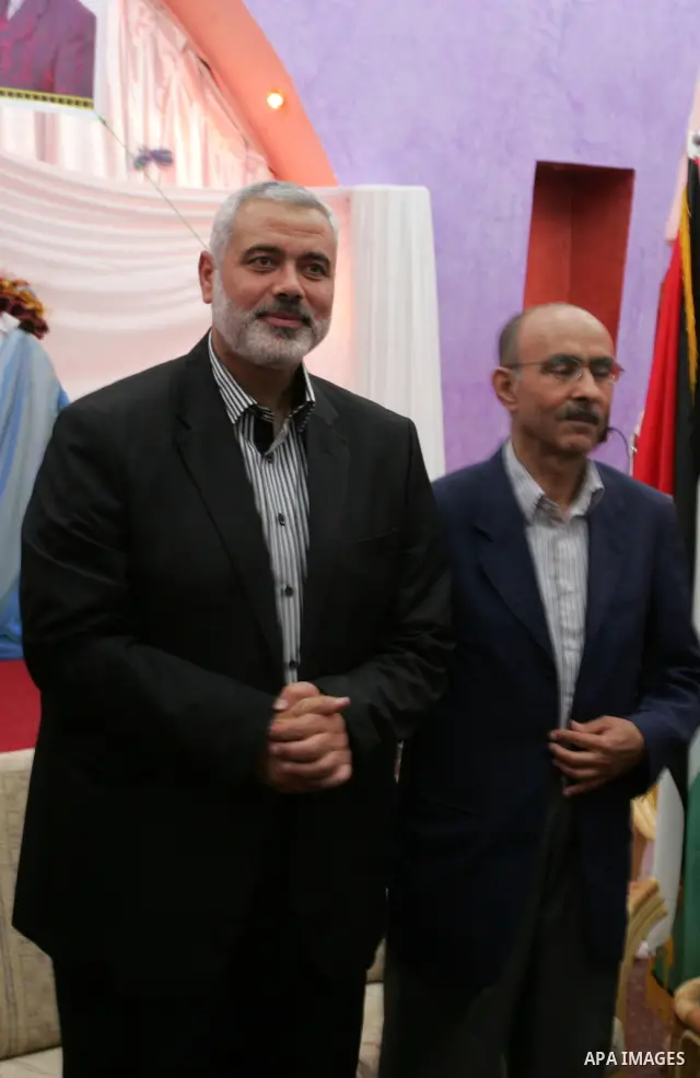 Palestinian prime minister in Gaza Strip, Ismail Haniya attends a celebration with freed Palestinian prisoners and their relatives in the southern Gaza Strip town of Rafah on Oct. 26,2011. Prisoners released to the Gaza...