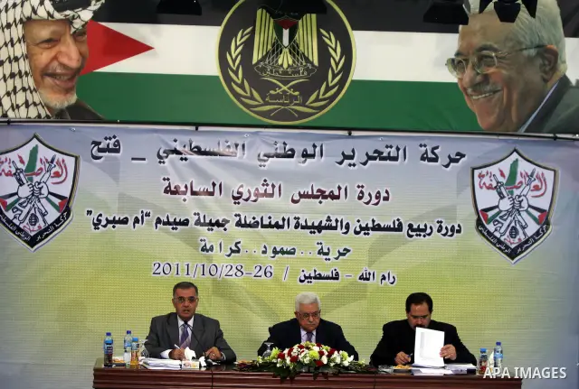 Palestinian Authority president and head of the Fatah movement Mahmud Abbas attends a Fatah "Revolutionary Council" meeting in the Palestinian West Bank city of Ramallah along with top officials on October 26, 2011, as t...