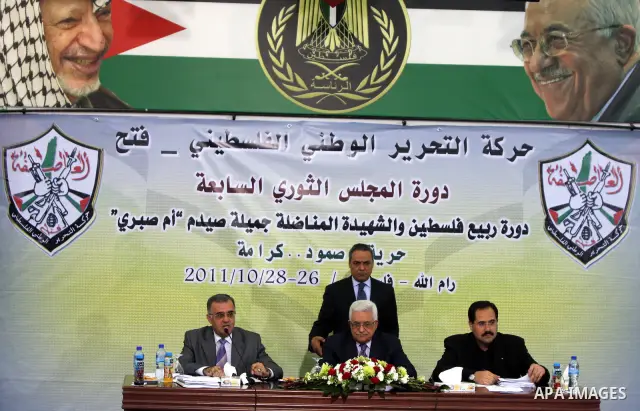 Palestinian Authority president and head of the Fatah movement Mahmud Abbas attends a Fatah "Revolutionary Council" meeting in the Palestinian West Bank city of Ramallah along with top officials on October 26, 2011, as t...