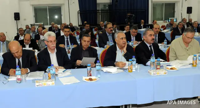 Palestinian Authority president and head of the Fatah movement Mahmud Abbas attends a Fatah "Revolutionary Council" meeting in the Palestinian West Bank city of Ramallah along with top officials on October 26, 2011, as t...