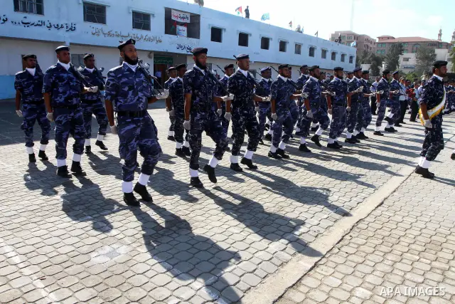 Hamas police officers demonstrate their skills during a ceremony in Gaza City in front of the media and Palestinian prisoners released in a recent swap between Hamas and Israel October 27, 2011. The Egyptian-brokered swa...
