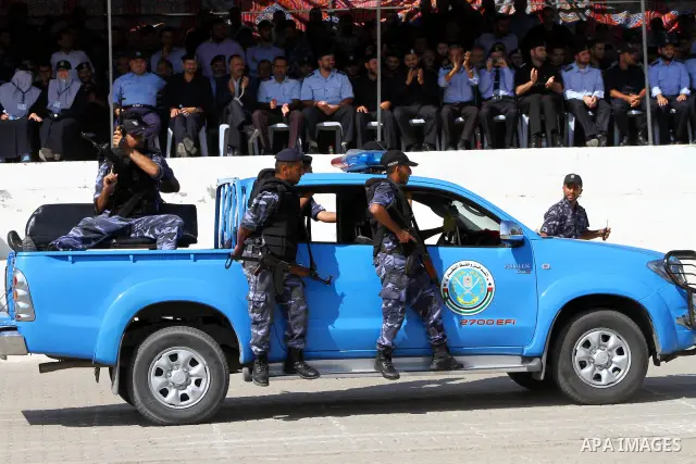 Hamas police officers demonstrate their skills during a ceremony in Gaza City in front of the media and Palestinian prisoners released in a recent swap between Hamas and Israel October 27, 2011. The Egyptian-brokered swa...