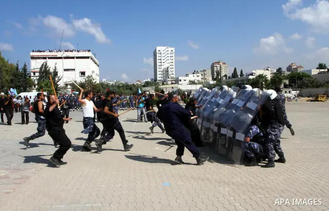 Hamas police officers demonstrate their skills during a ceremony in Gaza City in front of the media and Palestinian prisoners released in a recent swap between Hamas and Israel October 27, 2011. The Egyptian-brokered swa...