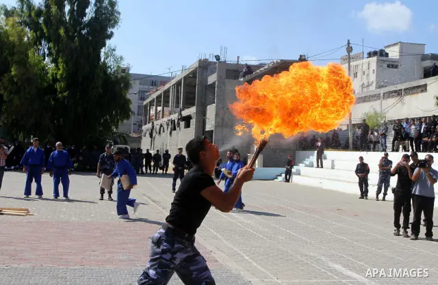 Hamas police officers demonstrate their skills during a ceremony in Gaza City in front of the media and Palestinian prisoners released in a recent swap between Hamas and Israel October 27, 2011. The Egyptian-brokered swa...
